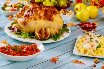 Pasta with shrimps, chicken and apples on table.