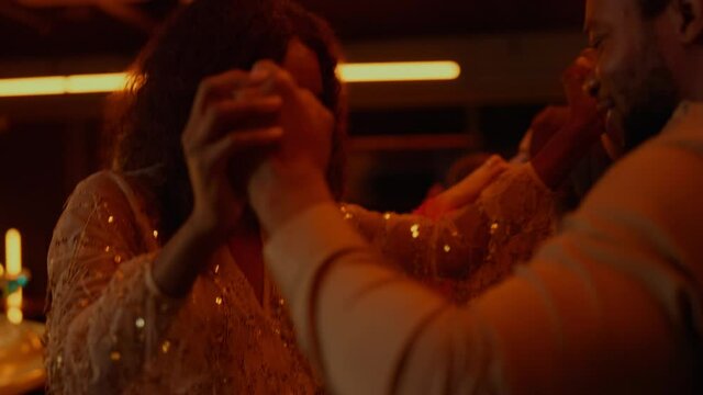 African american couple dancing on party in bar. Afro lovers having fun in club