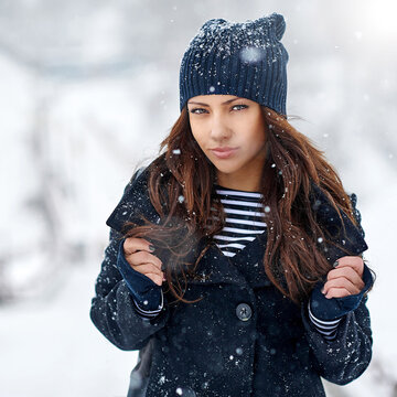 Portrait of beautiful girl in winter park