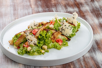 Salad with baked eggplant, mozzarella and romaine lettuce