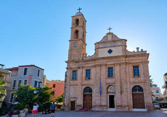 Fototapeta na wymiar Church and Greek Orthodox cathedral of presentation of Virgin Mary in Chania, Crete, Greece in early morning. Unrecognizable tourist take pictures