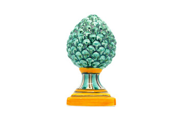 Green pine cone in Sicilian ceramic.Green pinecone in Sicilian ceramic from Caltagirone isolated on white background.