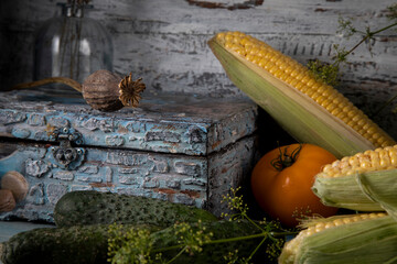 Fresh vegetables and vintage jewelry box on wooden table