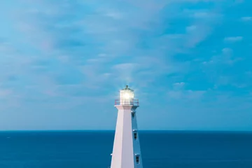 Foto auf Acrylglas lighthouse on the coast of newfoundland during blue hour © Erik
