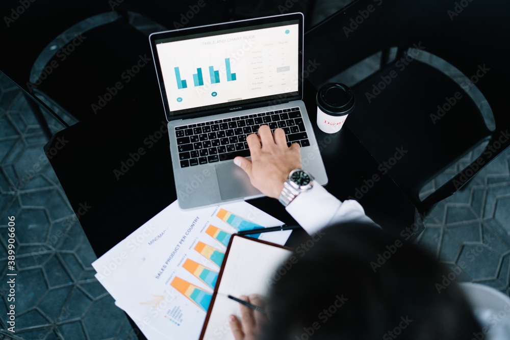 Aufkleber cropped overhead view of experienced businessman analyzing revenue strategy while working remotely i