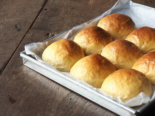 Dinner bread rolls in baking tray