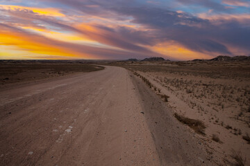 Fototapeta na wymiar landcape with awesome sunset sky over Namib Desert in Namibia, southern Africa