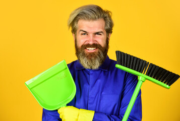 Fototapeta na wymiar Where have you been. husband cleaning house. Housework and domestic duty. Male janitor with cleaning supply. sweeping the floor. man cleaner. bearded man cleaning with mop. Janitor in gloves