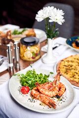 Fried shrimps in a plate on a table.