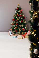 Christmas tree decor with gifts for the new year interior