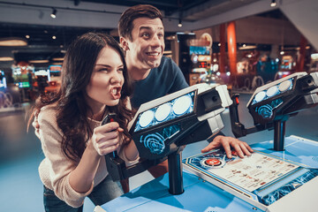 Man and woman playing games together in playroom.