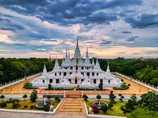 Samut Prakan, Thailand / September 27, 2020 : Wat Asokaram, Aerial View of White Buddhist Pagoda with Beautiful twilight.