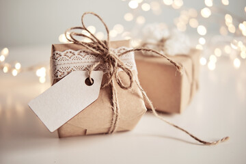 Fototapeta na wymiar Christmas sustainable gift boxes with blank gift card. Christmas zero waste