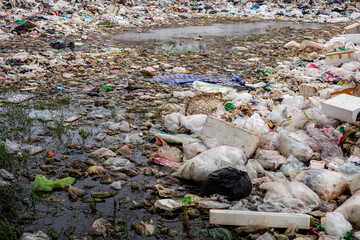 Obraz premium Water that is polluted with various garbage, garbage in landfill, toxic environment