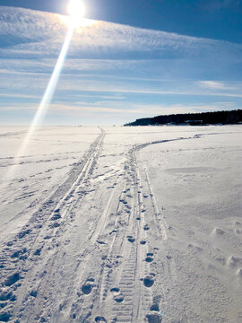 White winter road in a snow field