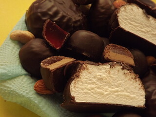 various sweets in chocolate and nuts close up