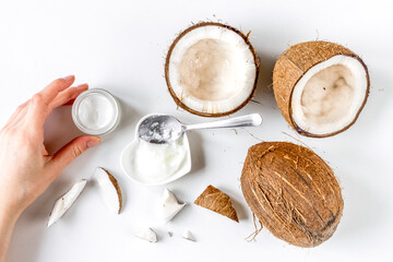 organic cosmetics with coconut on white background top view