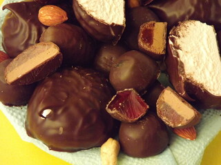 various sweets in chocolate and nuts close up