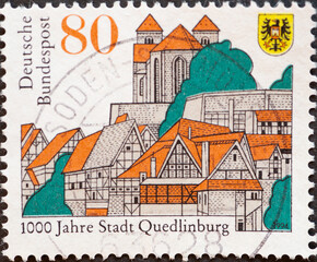 GERMANY - CIRCA 1994 : a postage stamp from Germany, showing a historical city view of Quedlinburg...