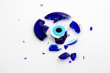 A broken evil eye bead. In culture and religious belief, the figure of the eye is regarded as a...
