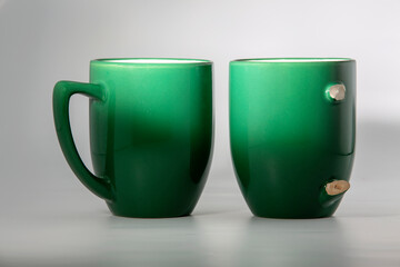 whole and broken on two parts of coffee cup for drink isolated on a white background
