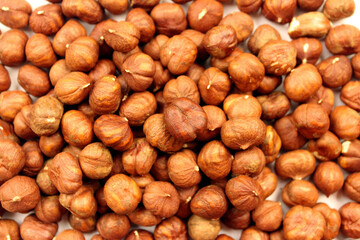 Brown dried peeled hazelnuts. Nut background