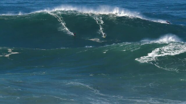 Slow motion of a big wave surfers sharing a monster wave in Nazar&eacute;, Portugal but things go wrong!! Nazar&eacute; is a small village in Portugal with the biggest waves in the world.