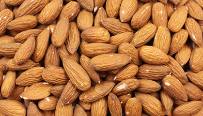 Almond background. Brown dried almonds