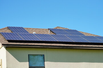 Solar panel on a house roof; Green energy from sun	