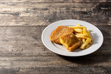 San Jacobo steak filled with cheese and ham on wooden table.Copy space