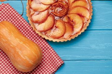 Apple tart pie on blue wooden background