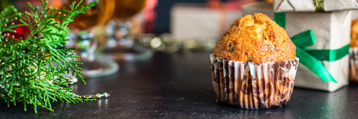 christmas sweet dessert muffins cupcakes and cup of tea party festive table setting holidays new year gift tasty top view copy space food background rustic