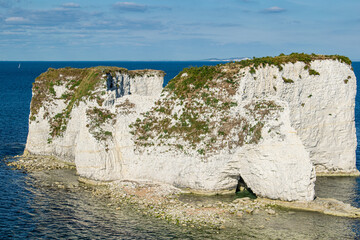 Old Harry Rocks with the distant Isle of Wight, near Swanage, Dorset, England, UK.