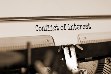 Text 'conflict of interest' typed on retro typewriter. Business concept. Beautiful background. Copy...