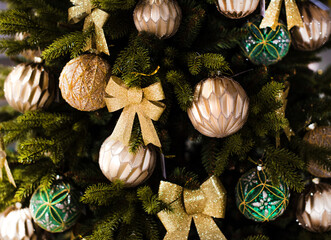 golden Сhristmas decorations and balls on the Сhristmas tree