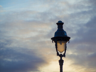 Light pole during the evening sky in Paris, France.