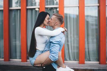 Passion emotion from spouse lovers kissing during prelude at urban setting in city, side view of...