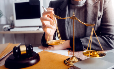 justice and law concept.Male judge in a courtroom on wooden table and Counselor or Male lawyer...