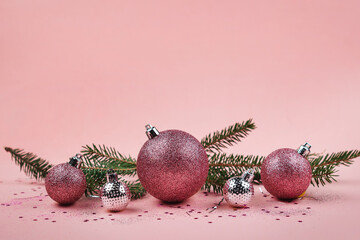 Christmas composition. Christmas pink decorations in pastel pink tones, copy space