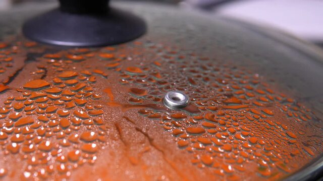 drops of steam on the lid of the pan. Food preparation