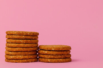 Stack of round oat cookies on paper background