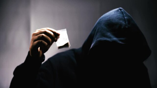 Drug trafficking concept. drug dealer selling dope in a nightclub.