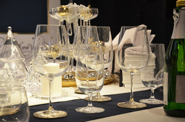 Beautiful gold place setting for Christmas. decorated table for a New Year or Christmas party at a corporate party or restaurant