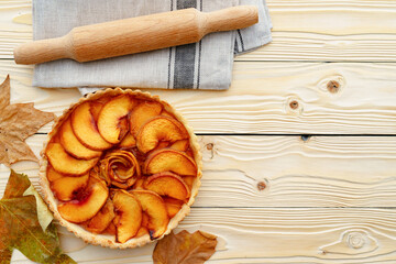 Top view of apple pie on wooden board