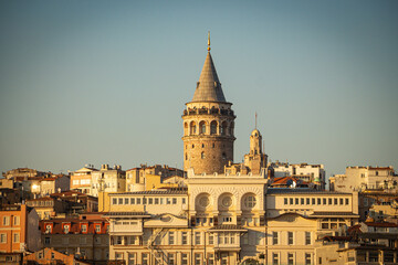 Galata Tower and Sun. Cityscape of Istanbul at sunset. Istanbul sunset background photo. Travel to Istanbul. 