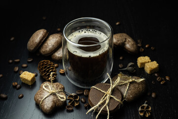 Festive Christmas coffee with sweets on a black background