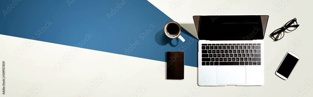 Poster laptop computer with a smartphone and office objects