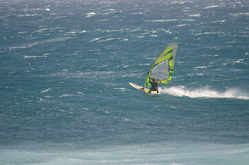 Windsurfer sailing in the coast of Arinaga. Aguimes. Gran Canaria. Canary Islands. Spain.