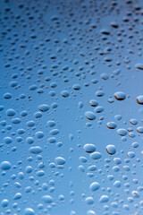 Water drops on a surface. Natural pattern background. Selective focus. 
