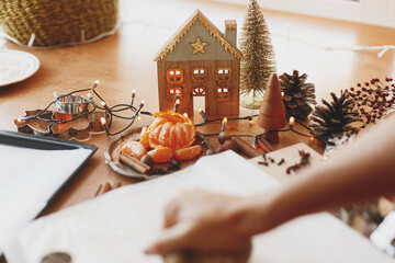 Festive christmas decorations on rustic table with raw gingerbread dough